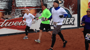 Abby running as a guide entering the stadium