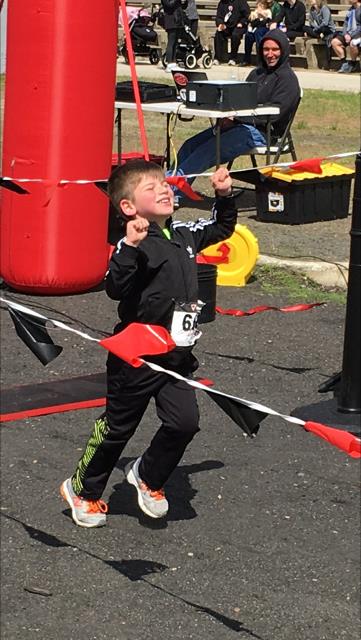 Priceless. Crossing the finish line